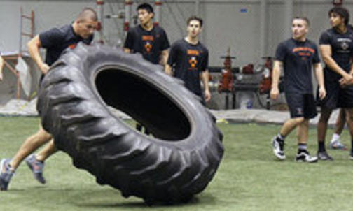 Tires, Weights, and a Common Goal: Wrestling, Men's Hockey Teams Face Off in Preseason Competition