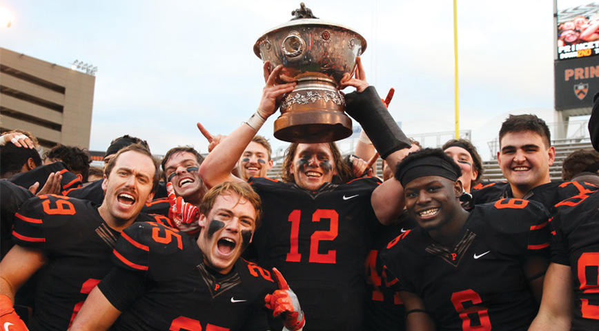 The football team holds up the Ivy League trophy while celebrating Princeton’s 2018 Ivy League title team finished the season 10-0