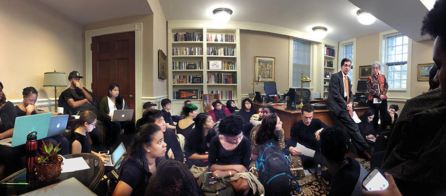 large group of students conducting a sit-in in President Christopher Eisgruber's office
