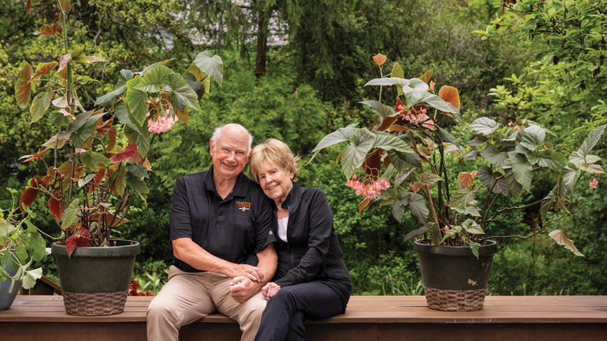 A.J. Stewart Smith *66 and his wife, Norma, are surrounded by Einstein’s begonias at their Princeton home.
