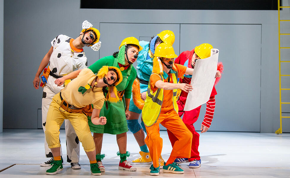 7 - Eric Samuel Romero, Anna M. Schloerb, Julia Diaz, Cooper Lajeunesse, Kimberly Richardson, and Zachary David Hodgkins in Children's Theatre Company's 2026 production of 'Go, Dog. Go! • Ve Perro ¡Ve!'. Photo by Kaitlin Randolph.jpg A group of actors dressed as dogs who are also construction workers all look at a map together.