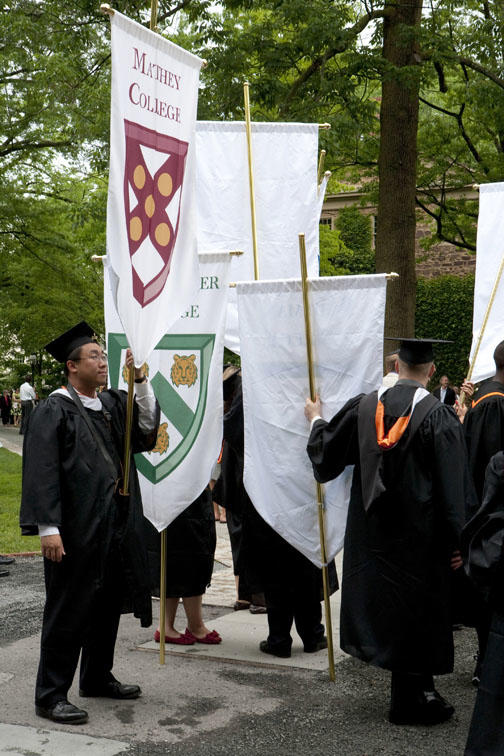 George Lan ’09 with the standard of Mathey College.