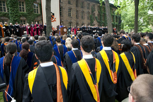 A view of administrators, faculty, trustees, and award winners in front of Nassau Hall.