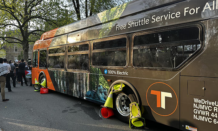 Protesters shoved traffic cones into the bus’s wheel wells.