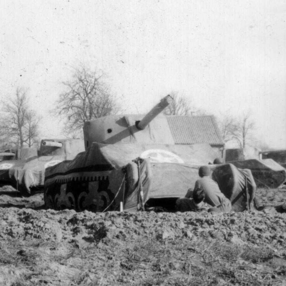 Soldiers set up the dummy tanks near the Rhine River for the Ghost Army's final operation.