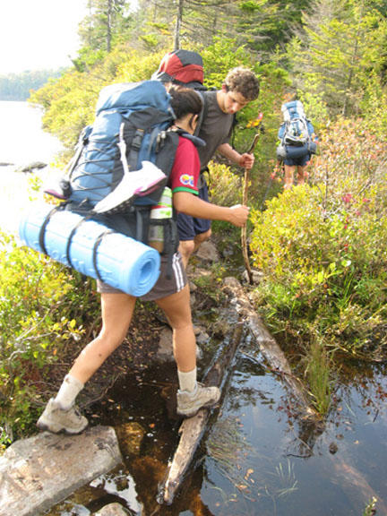 Hiking along a flooded section of trail in Vermont.