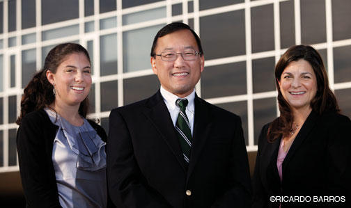 Earl Kim *93, center, with teacher Bonnie Lieu ’06, left, and board member Adelle Kirk ’93.