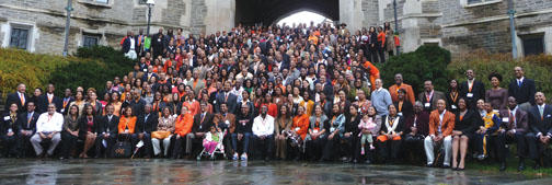 Above, returning alumni pose for a group photo on the steps of Blair Arch.