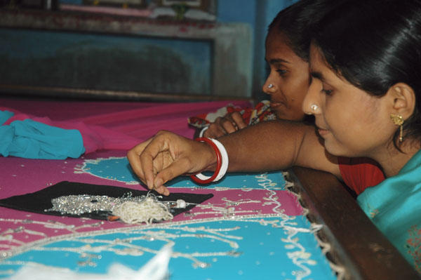 Some of Sarala's borrowers with purchases they've been able to make.