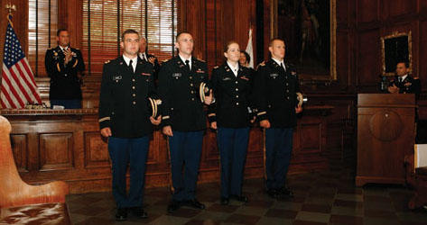 At the ROTC ceremony, from left, Richard Hagner ’09, Stephen Hammer ’09, Katrina Johns ’09, and George Puryear ’09 receive applause after receiving their commissions.