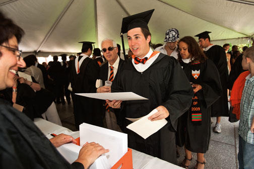 Arthur Ewenczyk '09 picks up his diploma after commencement.