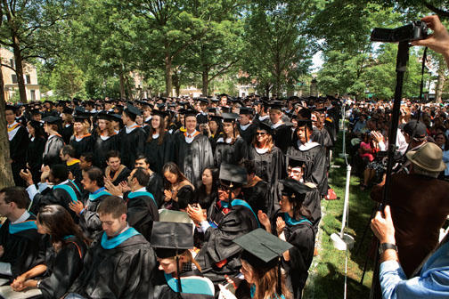 Graduates rise as their departments are called.