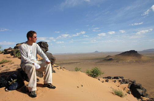 Iain Couzin in Mauritania, where he was studying locusts. His hands are bandged because a toxin from the locusts got on his skin and reacted to sunlight, causing pain.