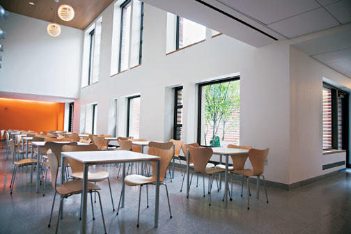 A brightly lit seating area on the first level of Dormitory A.