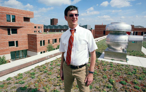 Nick Caputo ’73 on a green roof of one of Butler College’s new dorms.