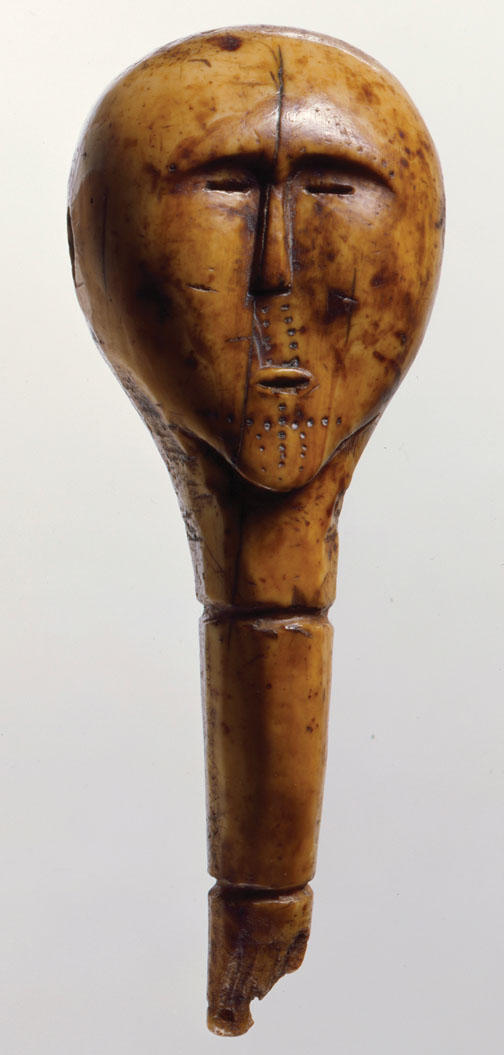 The head of a mechanical doll made of ivory that was excavated by a subsistence digger in the village of Savoonga on St. Lawrence Island and removed from the island in 1974–75.