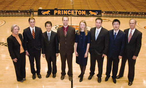 President Tilghman, left, and graduate school dean William Russel, right, with students honored on Alumni Day: From left are Pyne Prize winners Alex Barnard ’09 and Andy Chen ’09 and Jacobus Fellowship recipients Daniel Bouk, Hannah Crawforth, Peter D