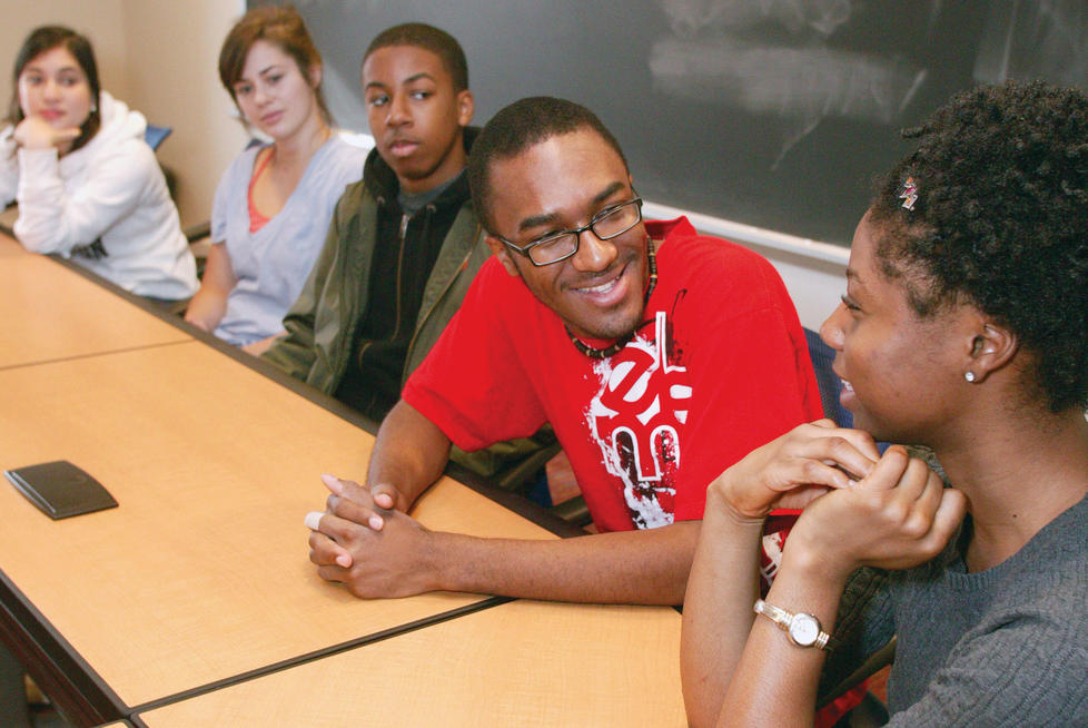 Reginald Galloway ’11 leads a Sustained Dialogue ­discussion group in the Fields Center. The meetings bring together students of different backgrounds to talk about race relations and other diversity-related issues. From left, Colette Biervliet-Schranz