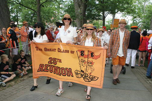 Carrying the 1986 banner are, from left, Kiku Loomis, Lisa Greenberg, and Clare Zagrecki Riley, with Reeve Miner Washburn following behind and and Michael Demko pulling a wagon.