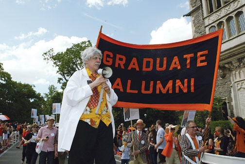 Graduate alumni are led by a stilt-walking mad scientist to celebrate the International Year of Chemistry.