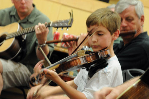 MUSIC SEISIÚ́N: Alumni and family members play traditional Irish tunes.
