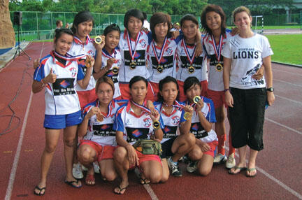 Volunteer coach Elena Olivi ’07, right, with the Vientiane Lions.