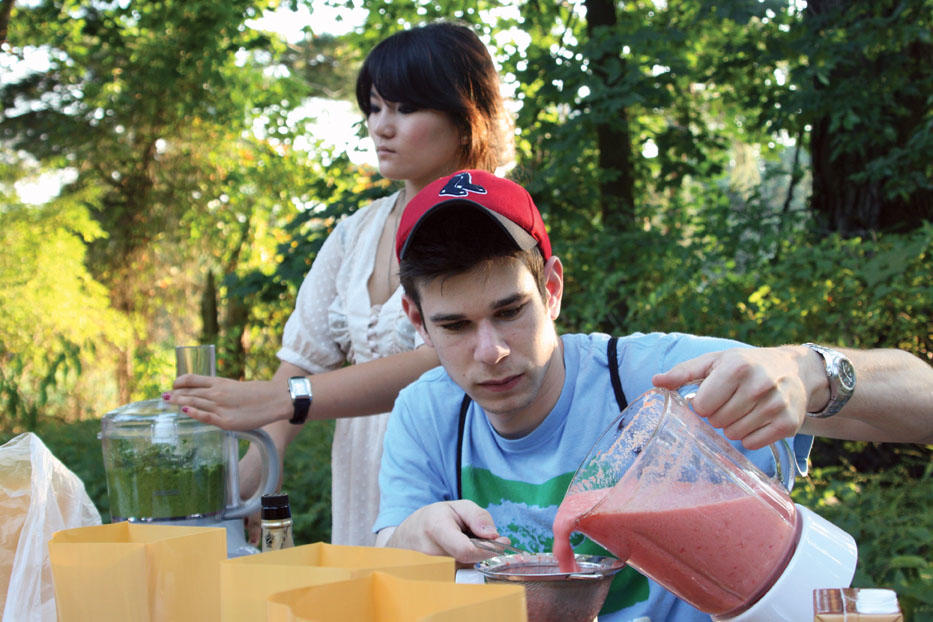 Yuanbo Liu ’10 and Danny Echelman ’11 help prepare a meal using vegetables students grew in the Garden Project near Forbes College. 