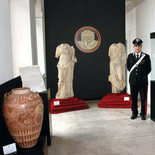 Art objects returned to Italy by American institutions in December were put on display in Rome; the red jar at left appears identical to one given by former antiquities dealer Edoardo Almagià ’73 to the Princeton art museum in 1999.