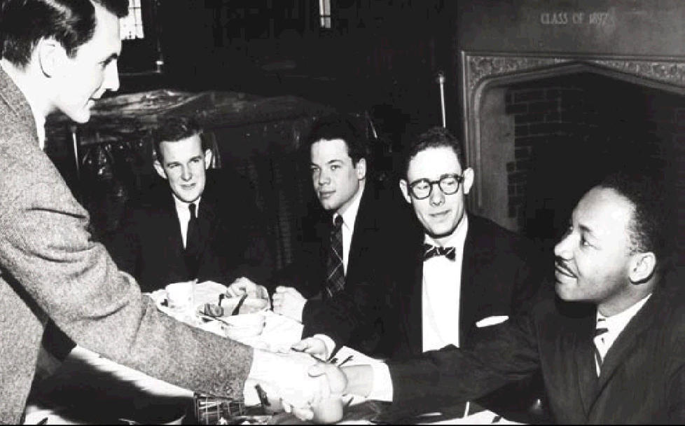 Rev. Dr. Martin Luther King Jr. at dinner on campus in 1960.