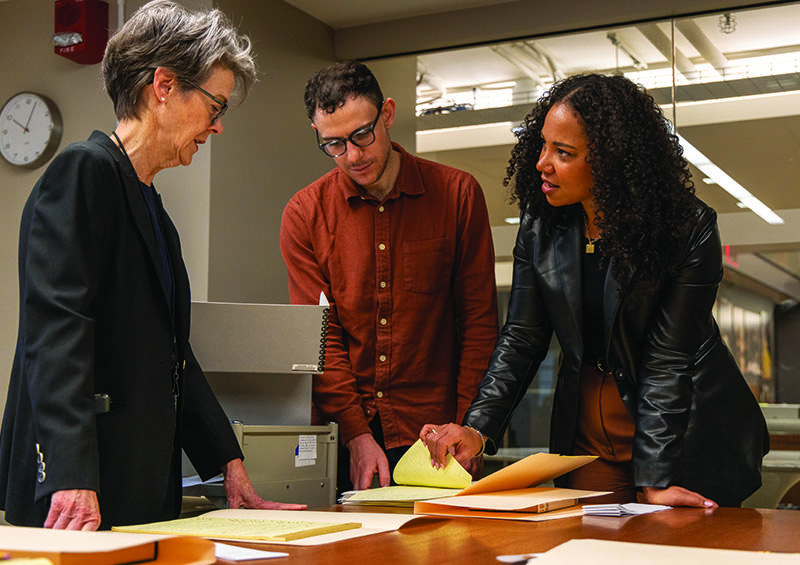 People reviewing Toni Morrison documents