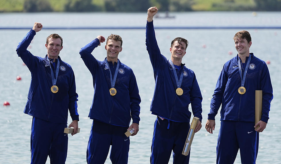 Gold medalist Nick Mead ’17, right, celebrates with U.S. men’s four teammates, from left, Liam Corrigan, Michael Grady, and Justin Best.