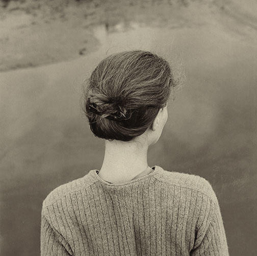 “I always want to find in a photograph a quintessential stillness,” Gowin says. Above, his wife, Edith, on Chincoteague Island, Va., in 1967.