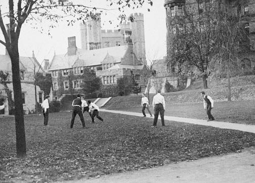Students play a game of ball behind Witherspoon Hall, circa 1930–50