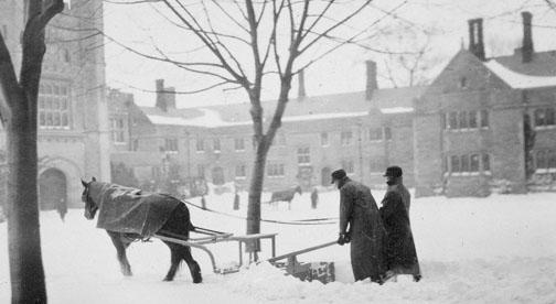 A snowstorm circa 1890 keeps horse-drawn snowplows working in front of Blair Arch