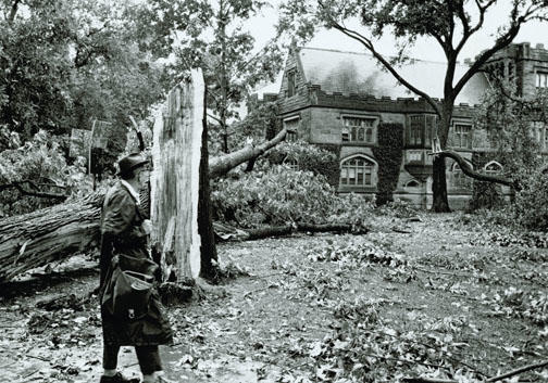 An onlooker assesses damage outside East Pyne after a storm in the 1950s