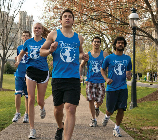 NB_Service47new.jpg Joe Benun ’15, center, trains with members of Team U before a half-marathon April 22 to benefit Shoe4Africa.