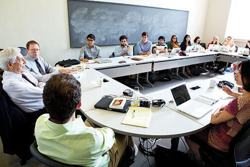 OTC-LlosaNew.jpg Students listen to Peruvian author Mario Vargas Llosa, left, during a seminar on his writings.