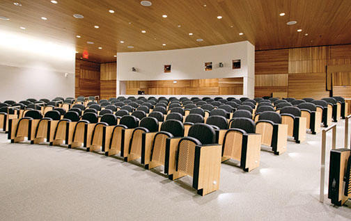 The 147-seat auditorium has oak paneling and custom seats made in Italy.