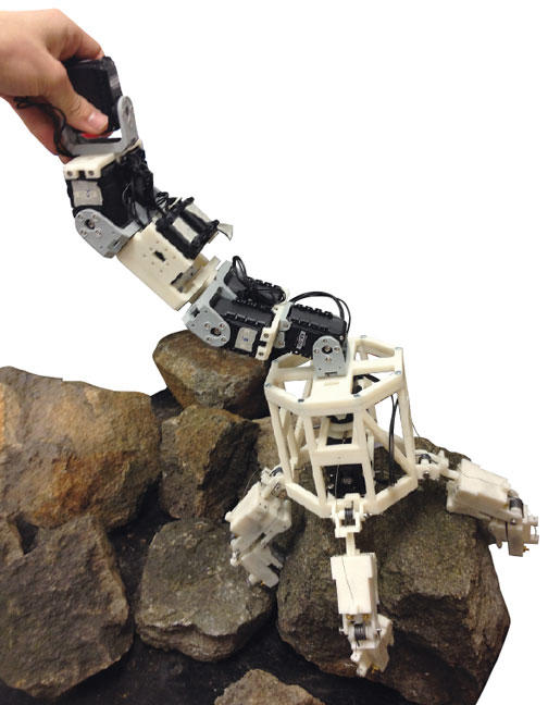 The parts of this model of a robot that could navigate an asteroid’s surface were created by students on a 3-D printer.