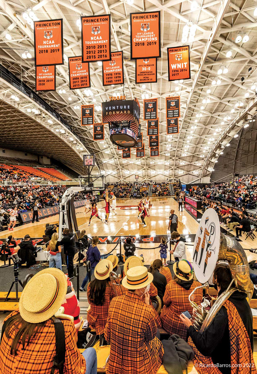 This is a photo of Princeton playing Harvard in men's basketball, with the marching band's backs to the camera.