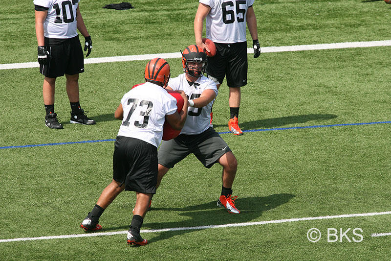 Center Joe Goss ’14, a starter since his freshman year, holds off a defender in a blocking drill.