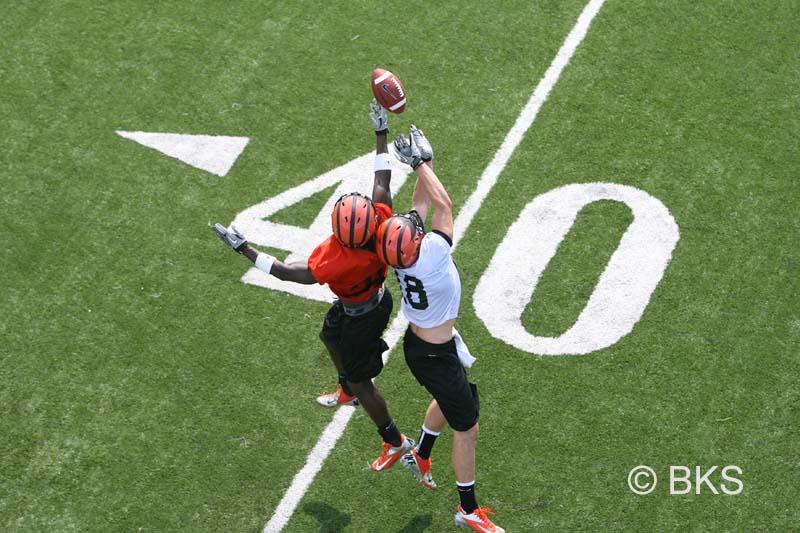 Trocon Davis ’14, left, knocks away a pass intended for Connor Kelley ’15.