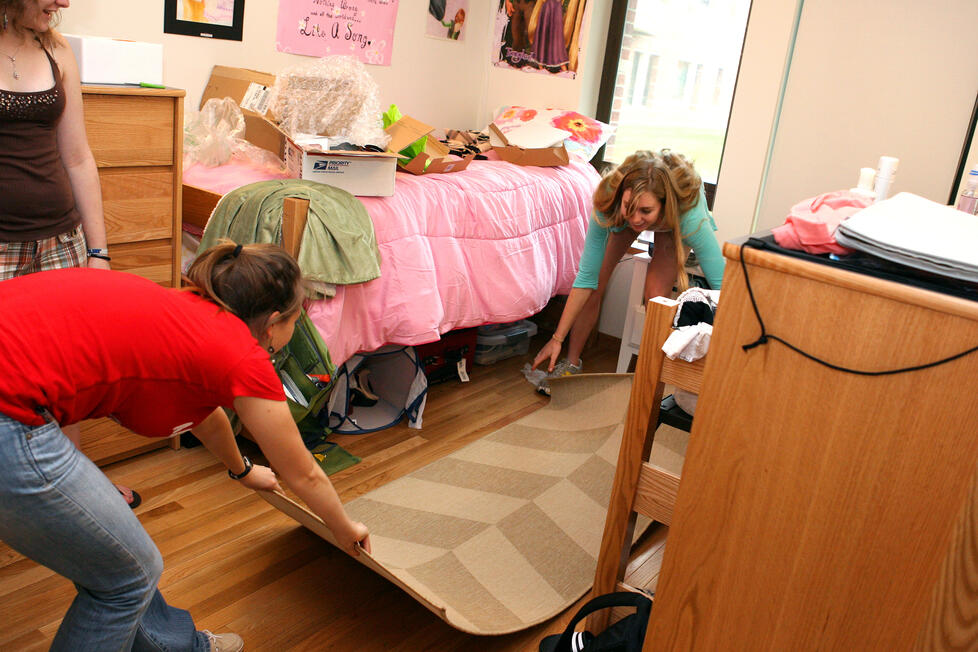 Daria Koren '15, left, and Silken Jones '15 set up their freshman dorm room.