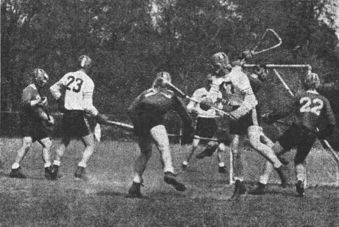 Princetonian19550512_LACROSSE.jpg Rutgers goalie Don Gucker leaps to stop a shot by Bob Russell ’55.