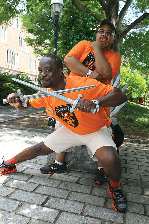 Reuners in the Class of 2000 — Pauly Rodney, front, and Clyde Beverly III — play the “Game of 00s.”