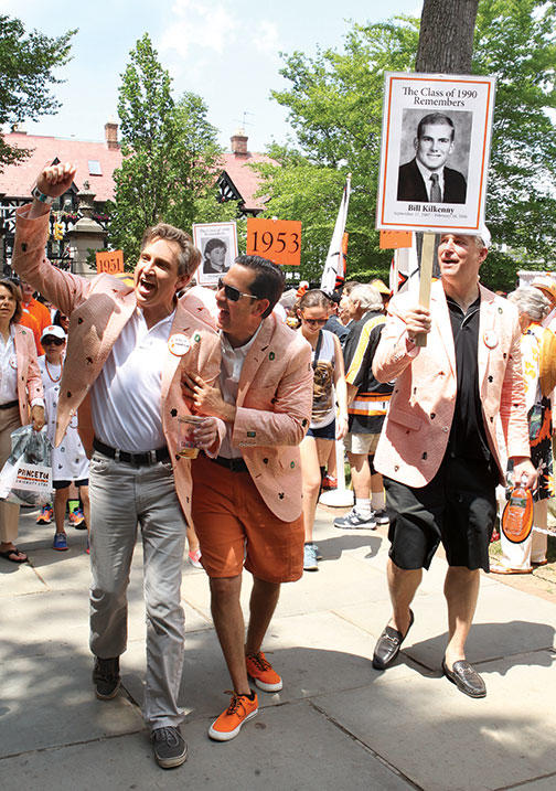 25th reuners, from left: Kent Hawryluk ’90, David Diamond ’90, and Brad Williams ’90 carrying a sign honoring his classmate and friend