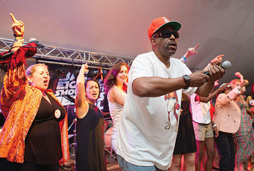 Rapper and actor Tone Lōc gets the crowd moving at the headquarters of the Class of 1990.