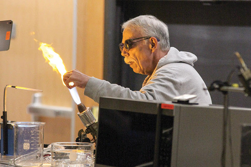 Mike Souza, the recently retired scientific glassblower in the chemistry department, entertains