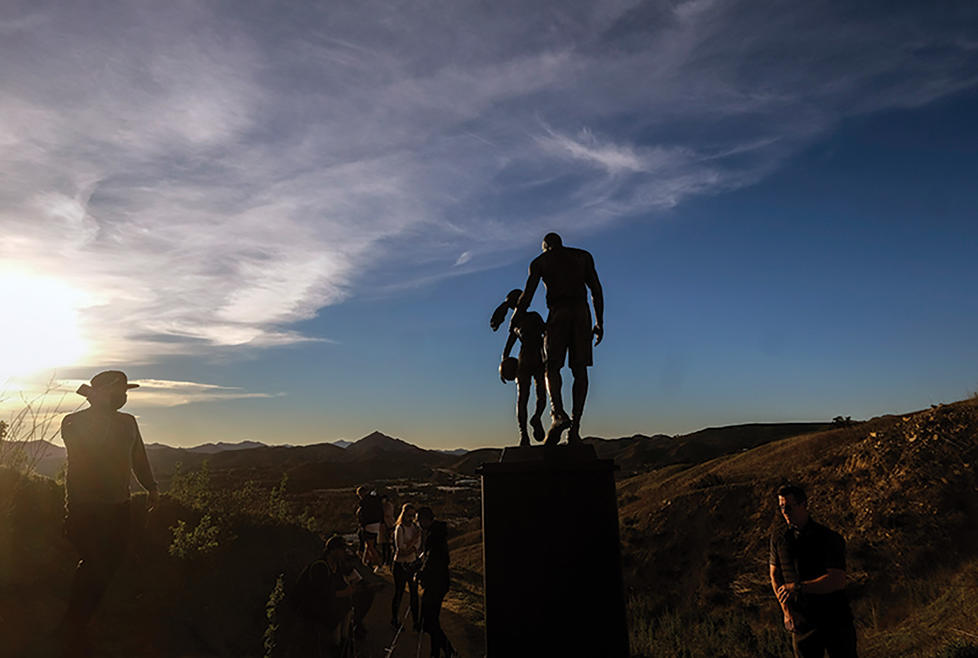 Former NBA player Kobe Bryant, his daughter Gianna Bryant, and seven other people are remembered with a bronze statue  at the site of the helicopter crash in Calabasas, California, where they died in 2020.