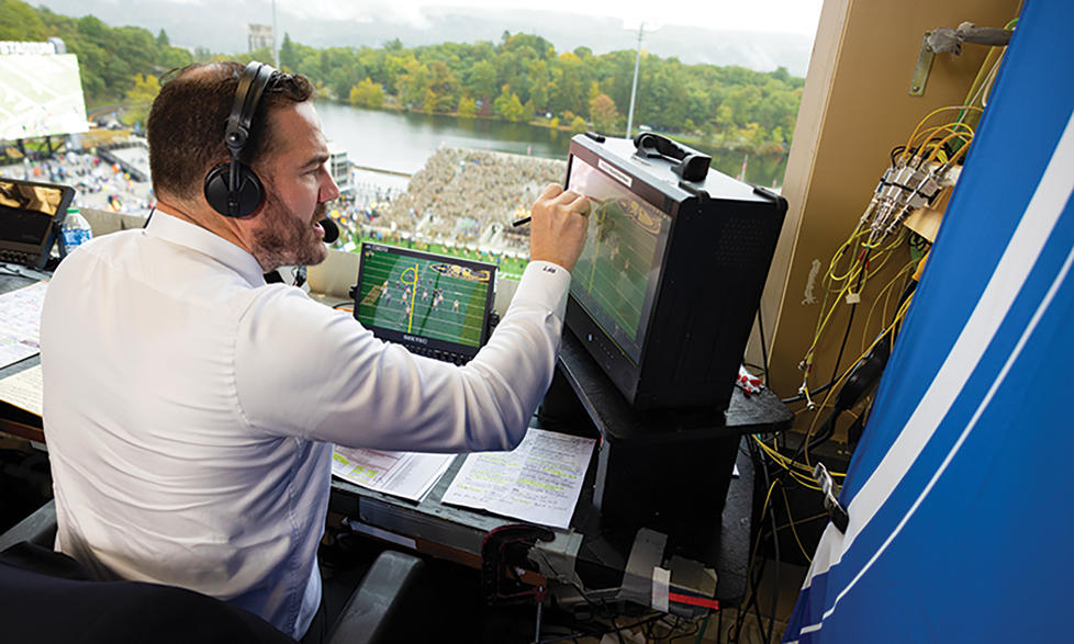 Tucker uses the Telestrator to break down a play. 